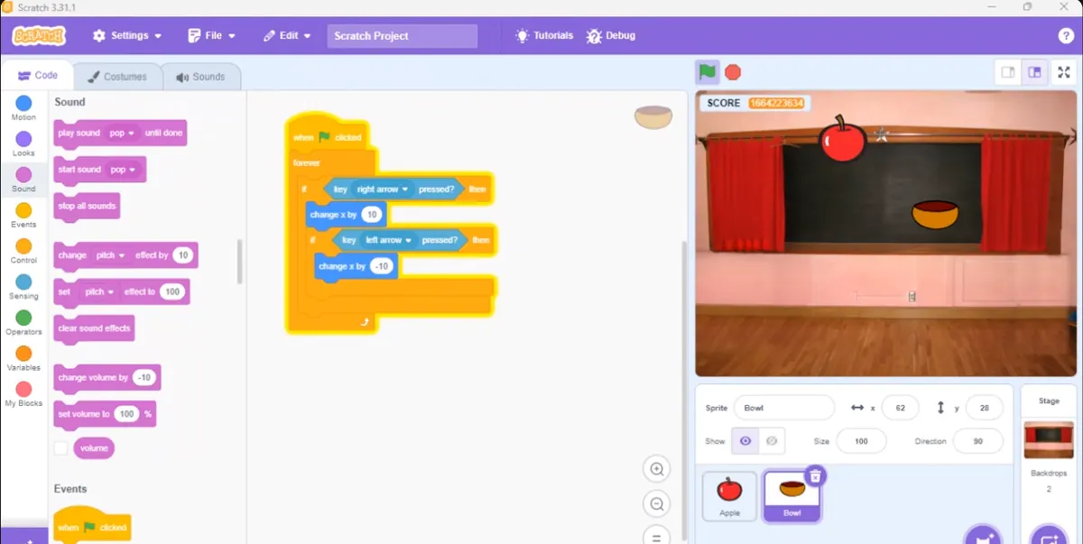 A Scratch catch-the-apple game built by a Sabi Coders student